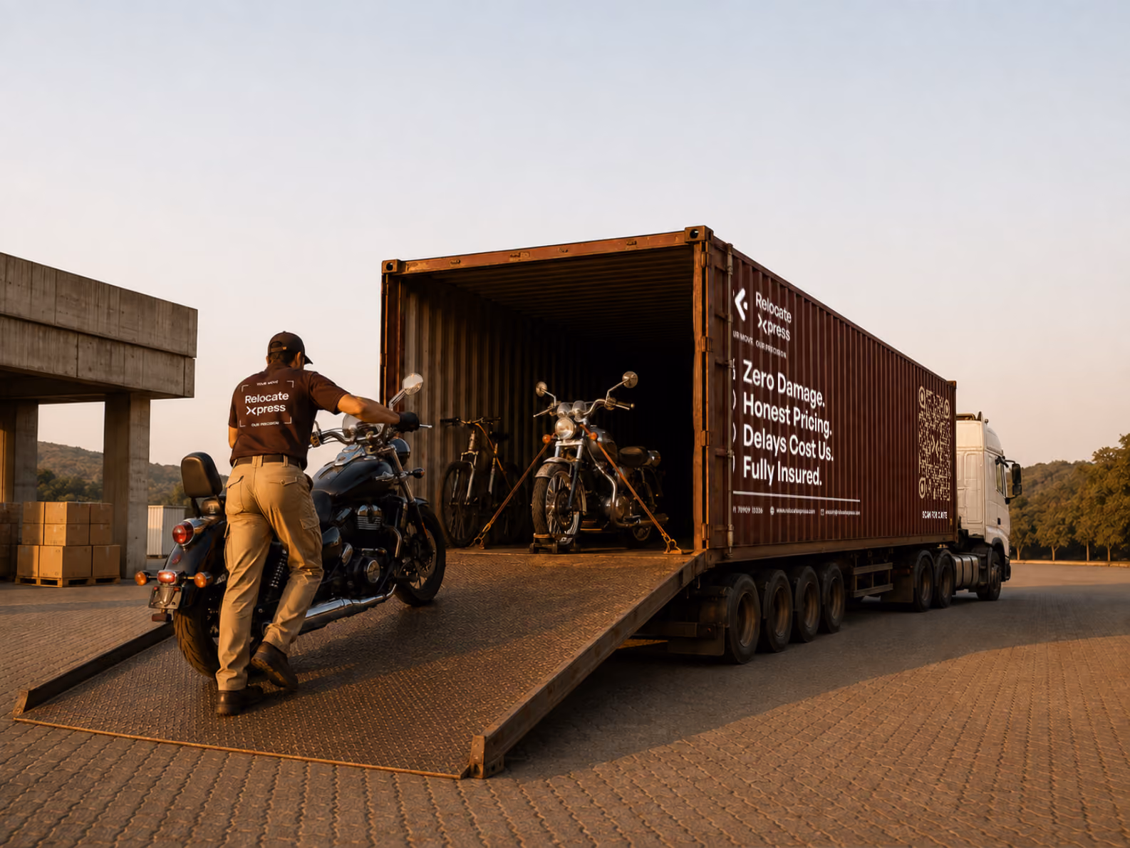 Worker loading motorcycle into moving truck on highway
