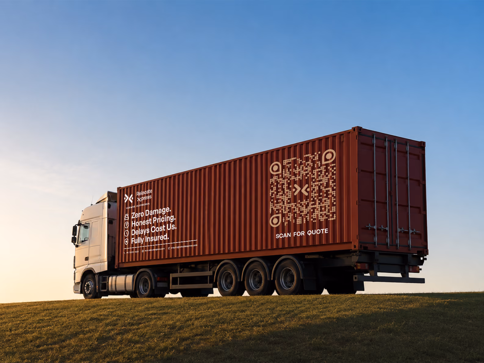 Branded moving truck with cargo container on open highway under clear sky