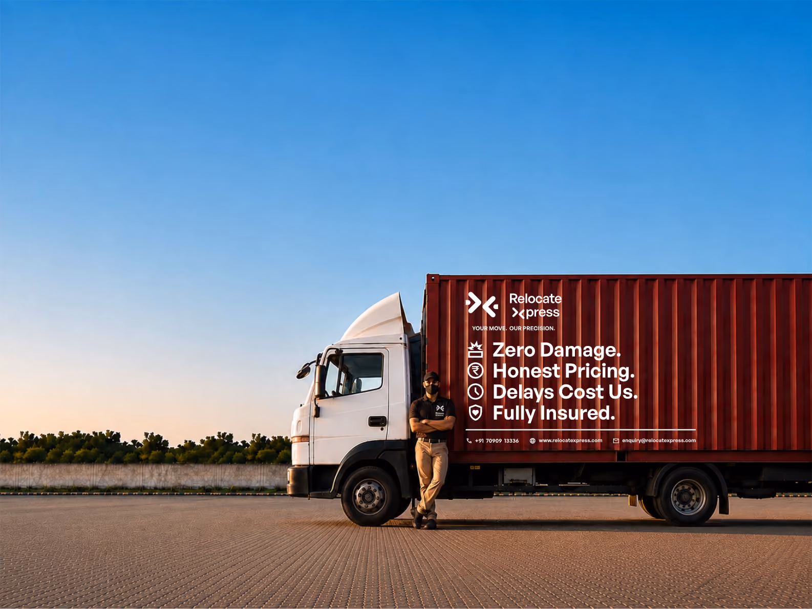 Driver posing next to moving truck with branded cargo container