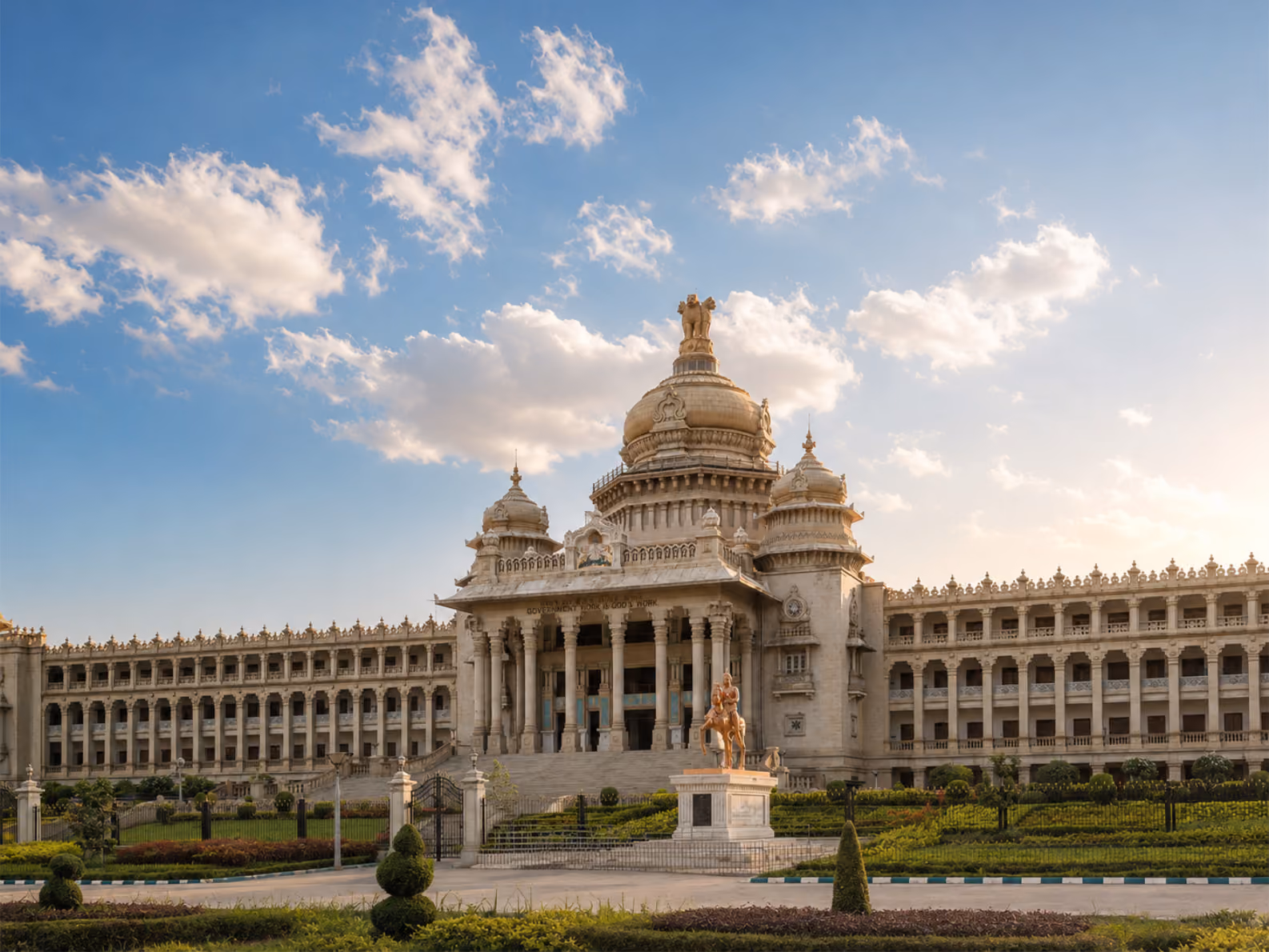 Vidhana Soudha legislative building with dome and equestrian statue in Bangalore